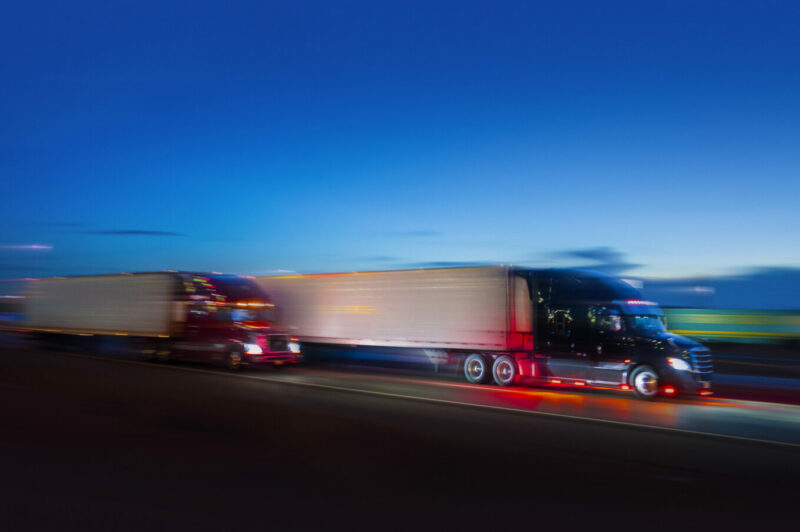 Picture of blurry trucks on the road