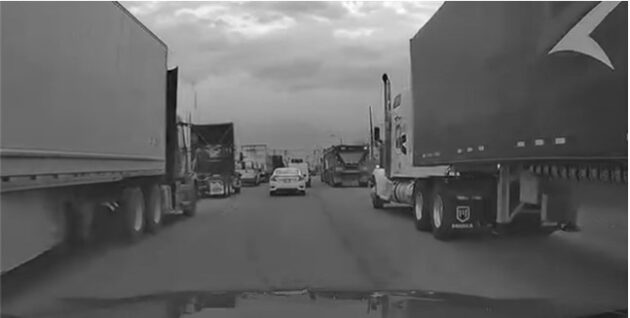 A road congested with trucks