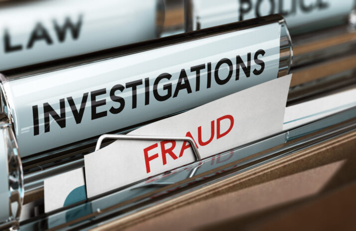 Picture of files marked fraud, investigation
