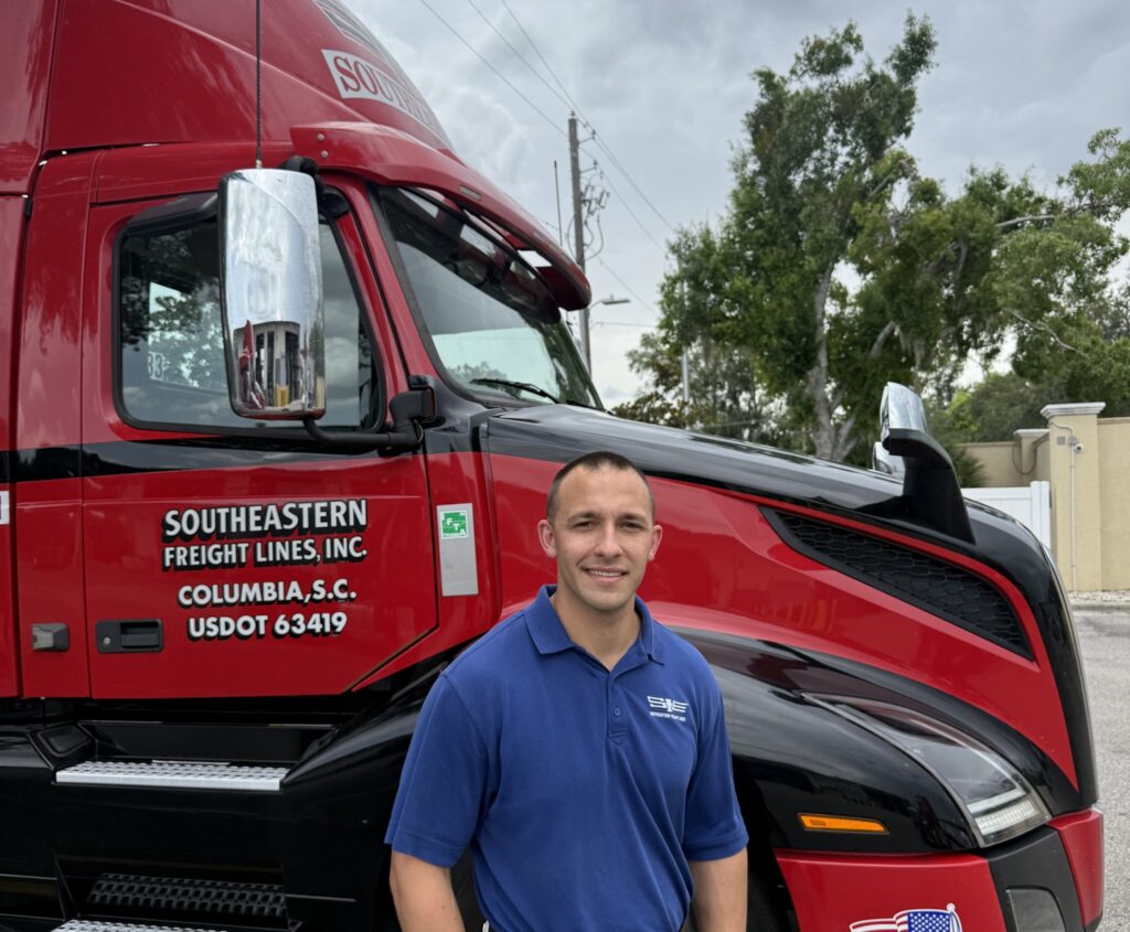 Cullins in front of SFL truck 