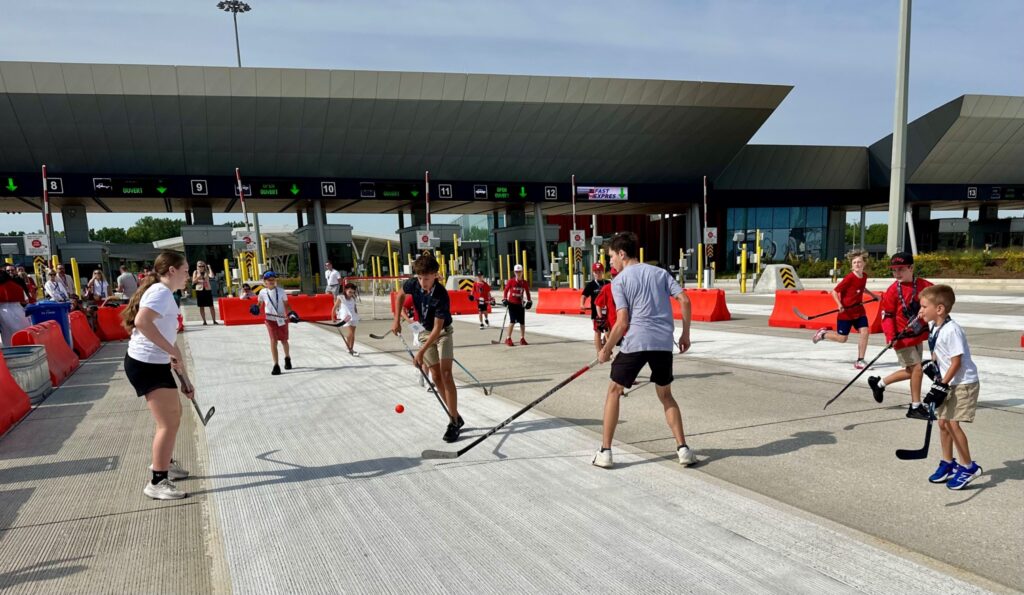 Kids playing ball hockey
