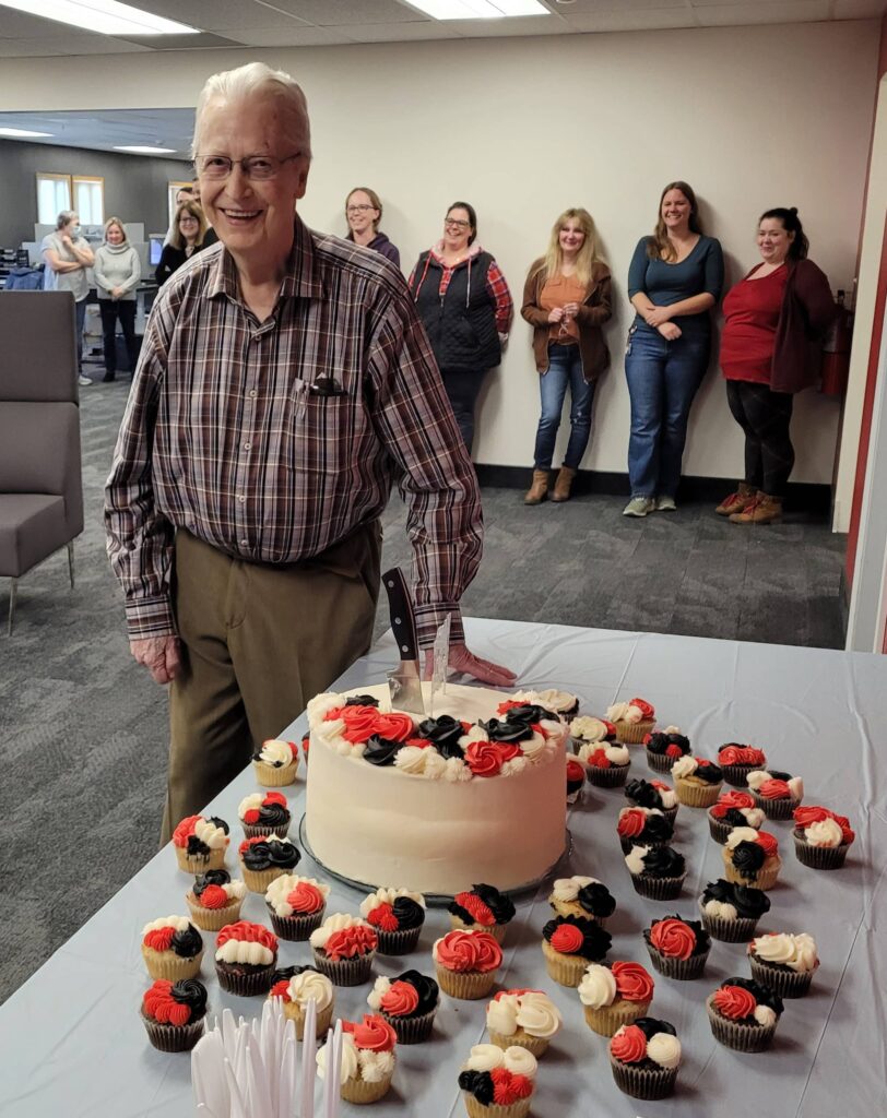 Doug Smith celebrates his 90th birthday in 2023 in the company's HQ